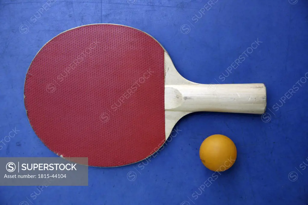 Close-up of a table tennis bat and a ball