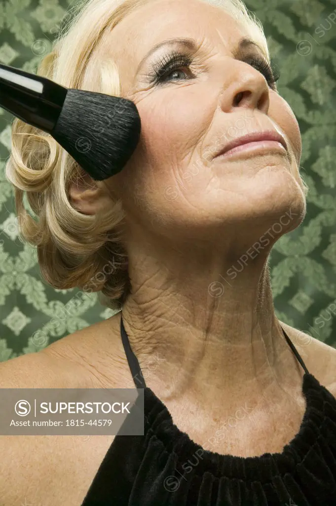 Elder lady with make up brush