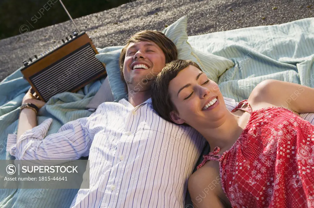 Young couple relaxing on blanket