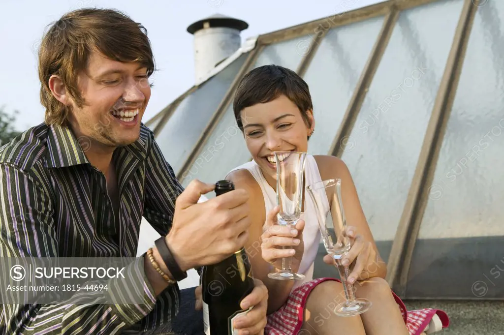 Young couple drinking champagne