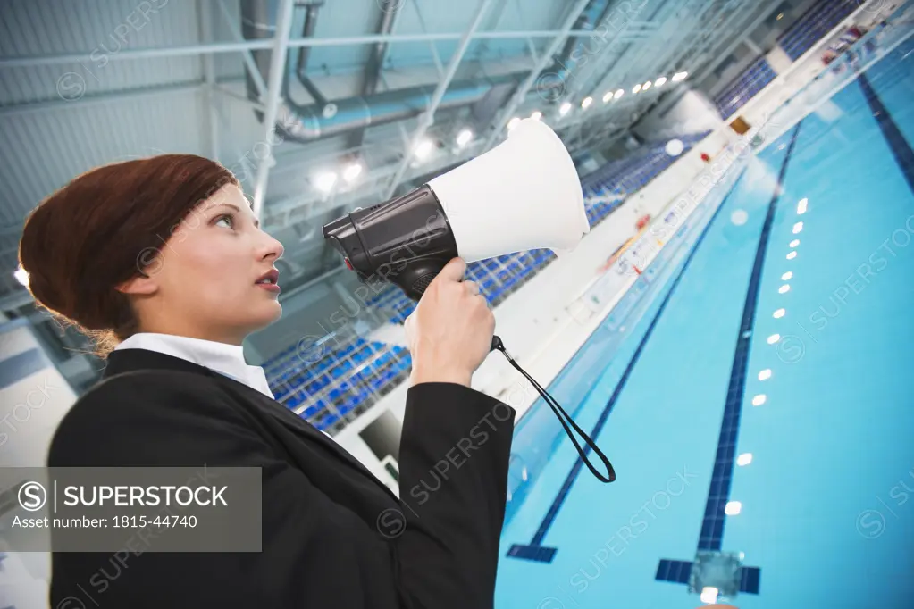 Young woman using megaphone