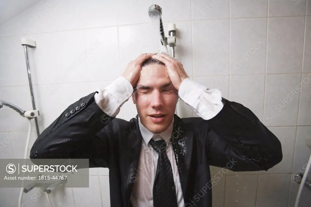 Businessman under shower