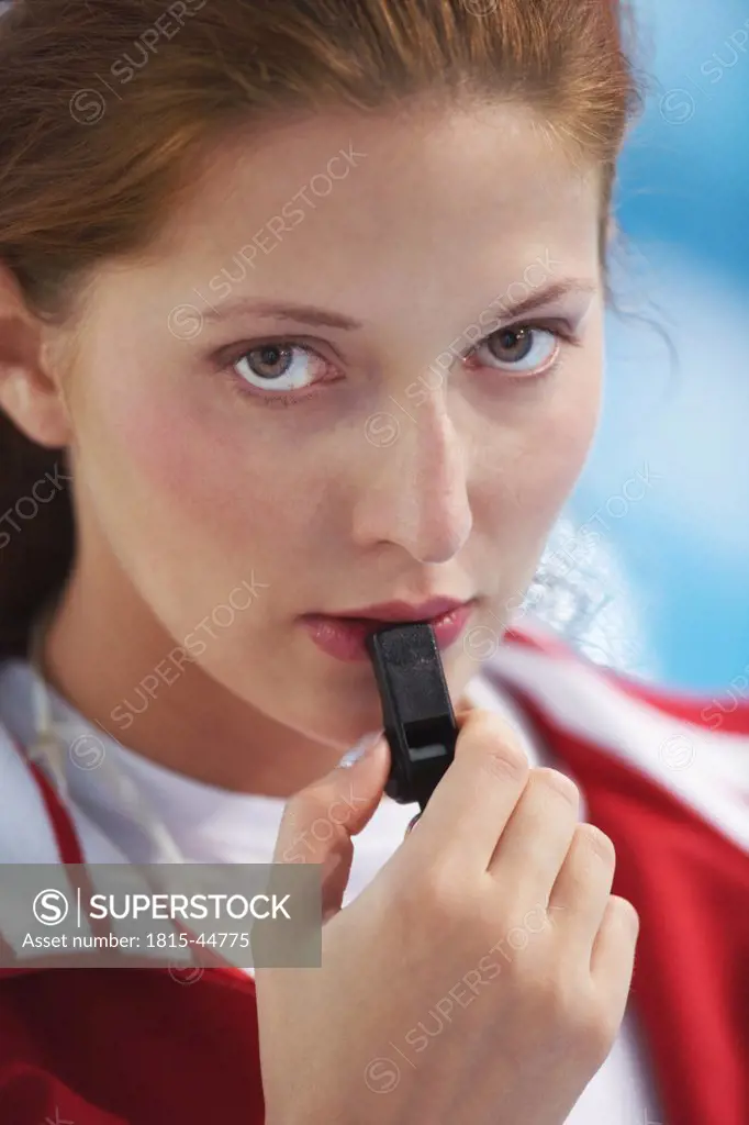 Young woman with whistle