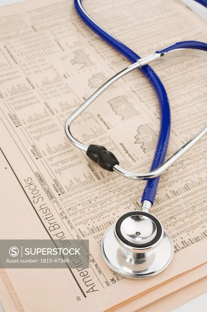 Stethoscope on stock reports, elevated view