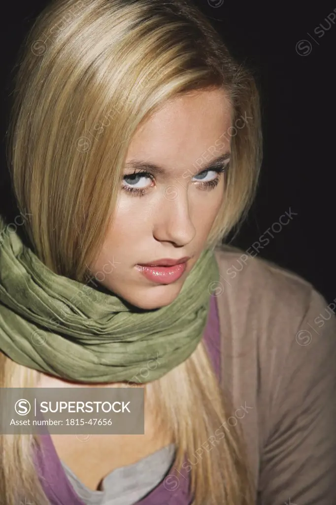 Young woman wearing scarf, portrait, close-up