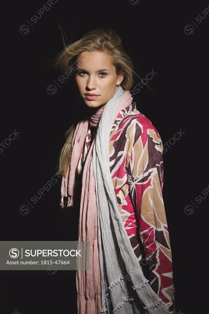 Young woman wearing scarf, portrait