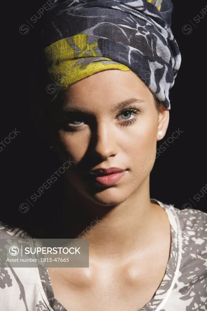 Young woman wearing head scarf, portrait