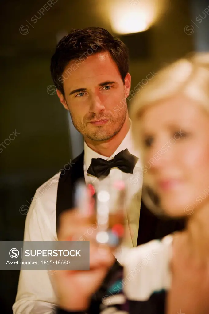 Blonde woman and barkeeper in bar