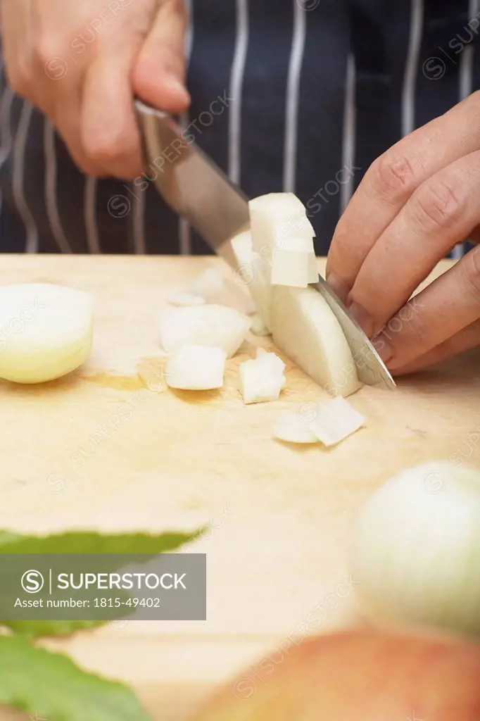 Person dicing an onion, close_up