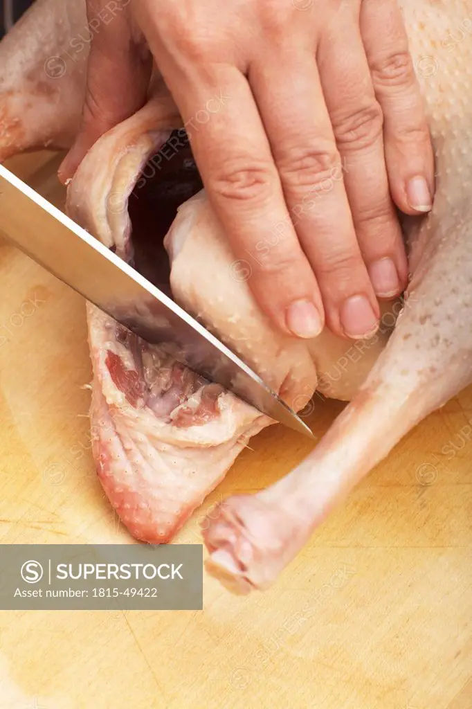 Roast goose, preparation, Person removing parson´s nose, close_up