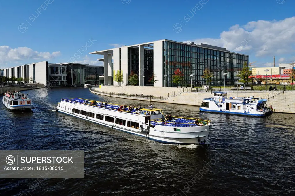 Europe, Germany, Berlin, Reichstag, View of Paul_Loebe_Building, parliament building and tourboats on Spree river