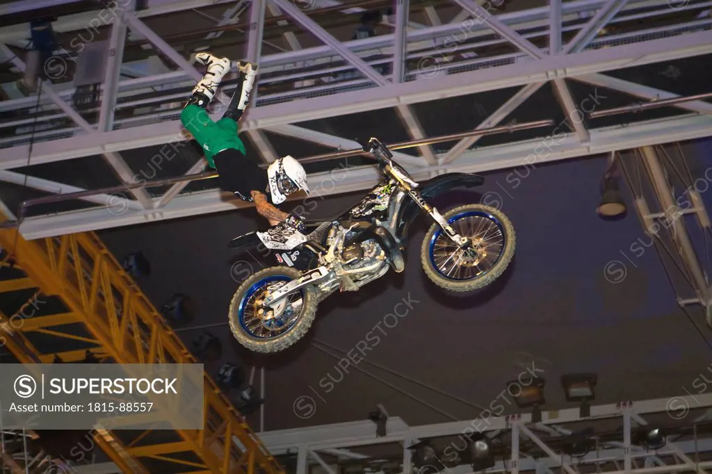 Germany, Munich, Olympia Hall, View of freestyle motocross rider performing stunts