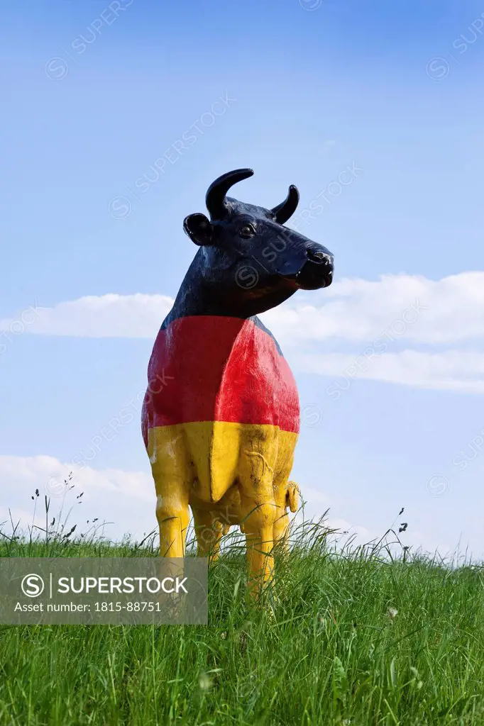 Austria, Lower Austria, Oed_Öhling, View of cow sculpture painted with german flag