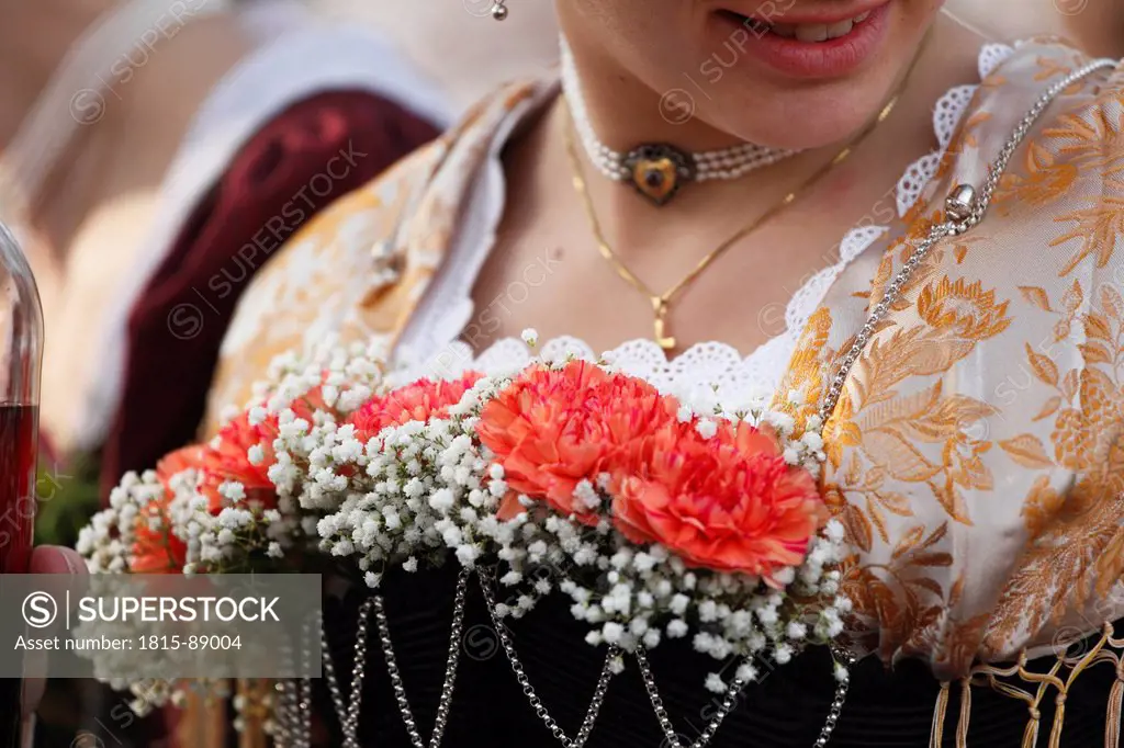 Europe, Germany, Upper Bavaria, Bad Toelz, Woman wearing flowers on dress