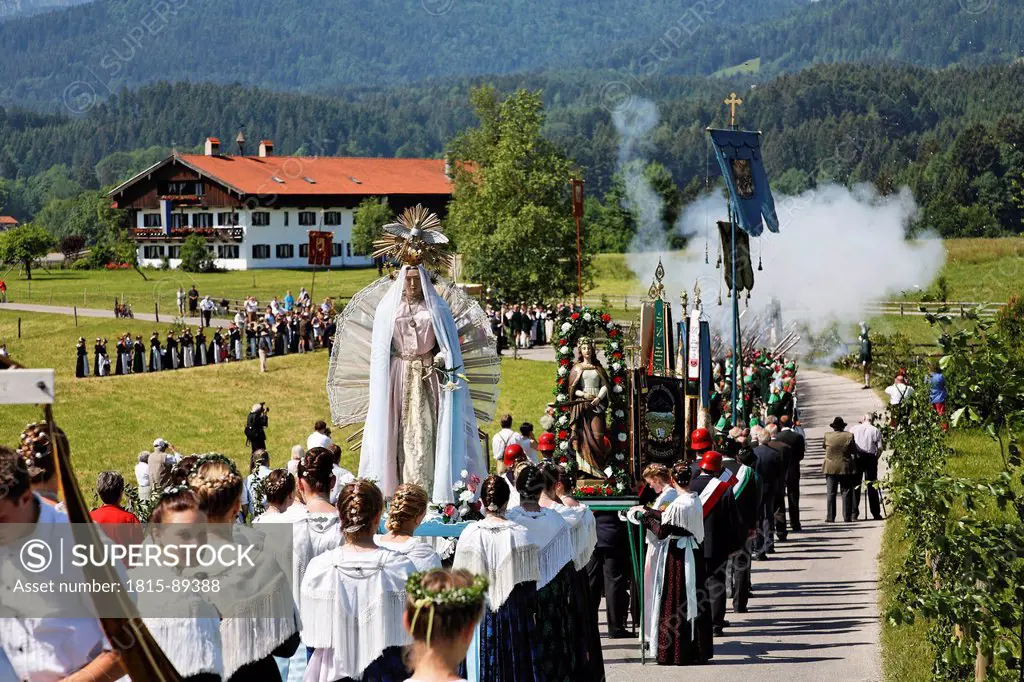Germany, Bavaria, Upper Bavaria, Wackersberg, Feast of Corpus Christi procession passing through field