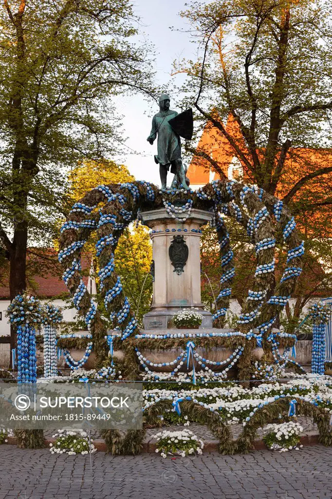 Germany, Bavaria, Upper Bavaria, Ingolstadt, Paradeplatz, View of fountain and statue decorated with easter eggs