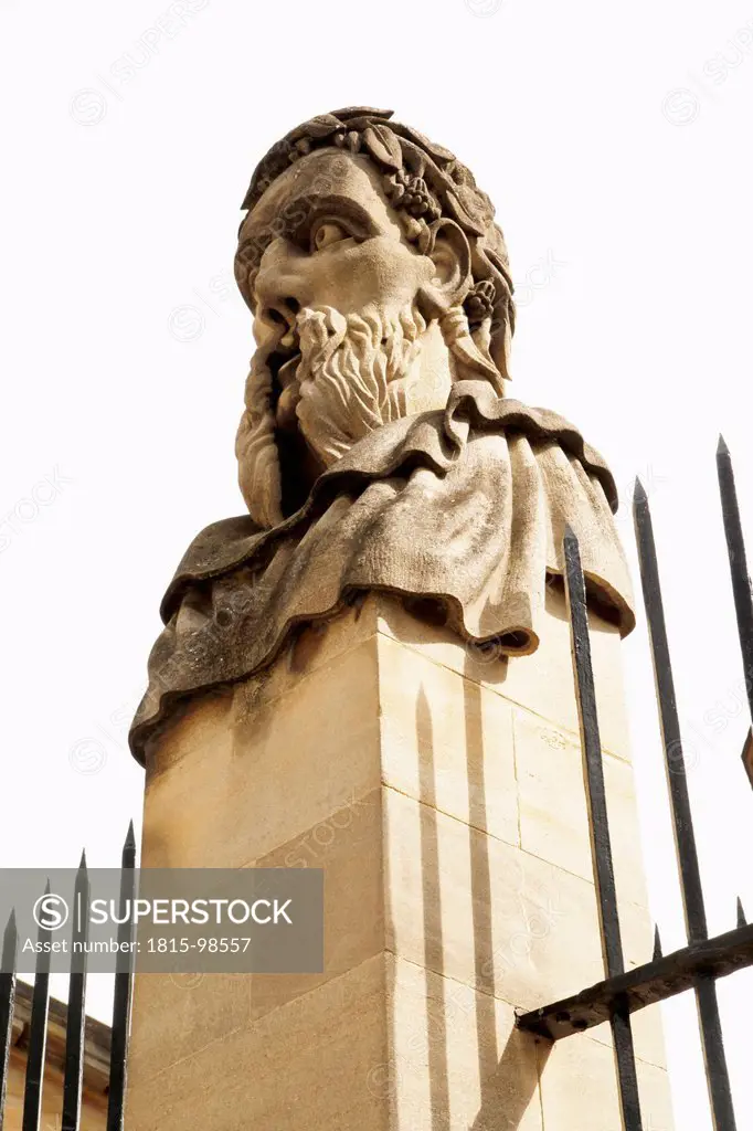 UK, England, Oxford, Statue head on fence of Bodleian Library