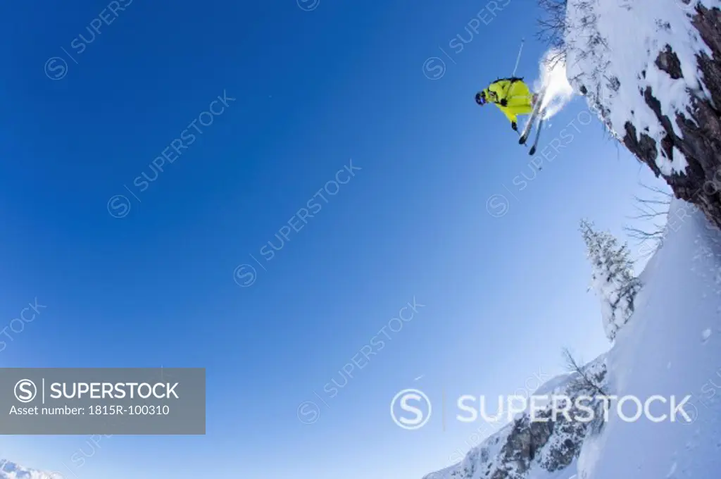 Austria, Tyrol, Kitzbuhel, Mid adult man skiing