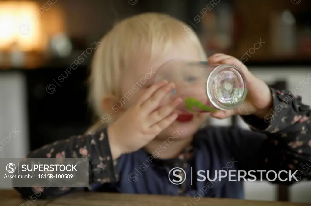 Germany, Bavaria, Girl drinking from glass