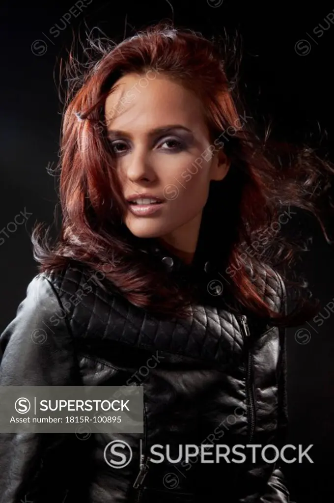 Young woman in black dress and leather jacket, portrait