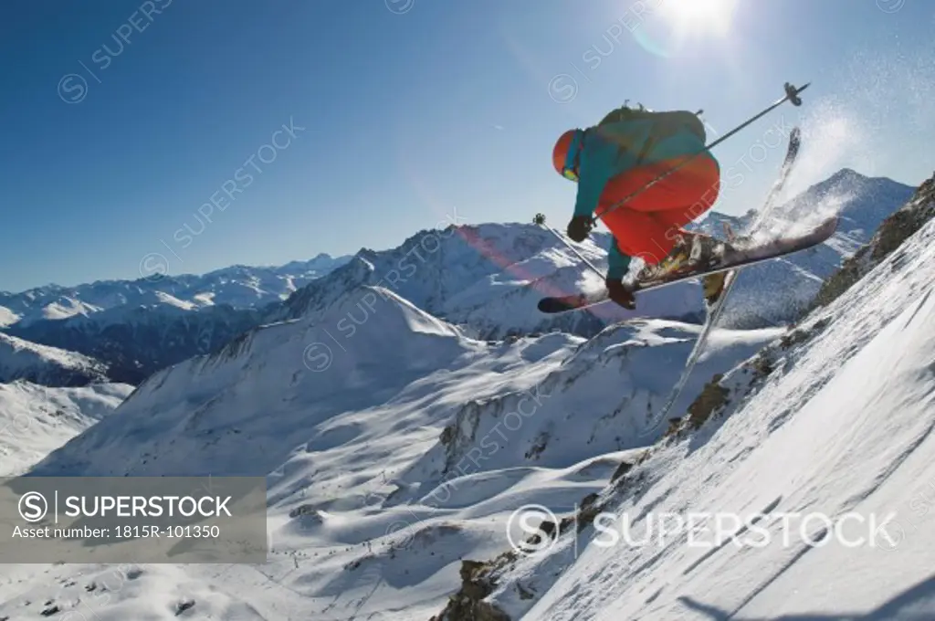 Austria, Tirol, Ischgl, Man ski jumping in snow