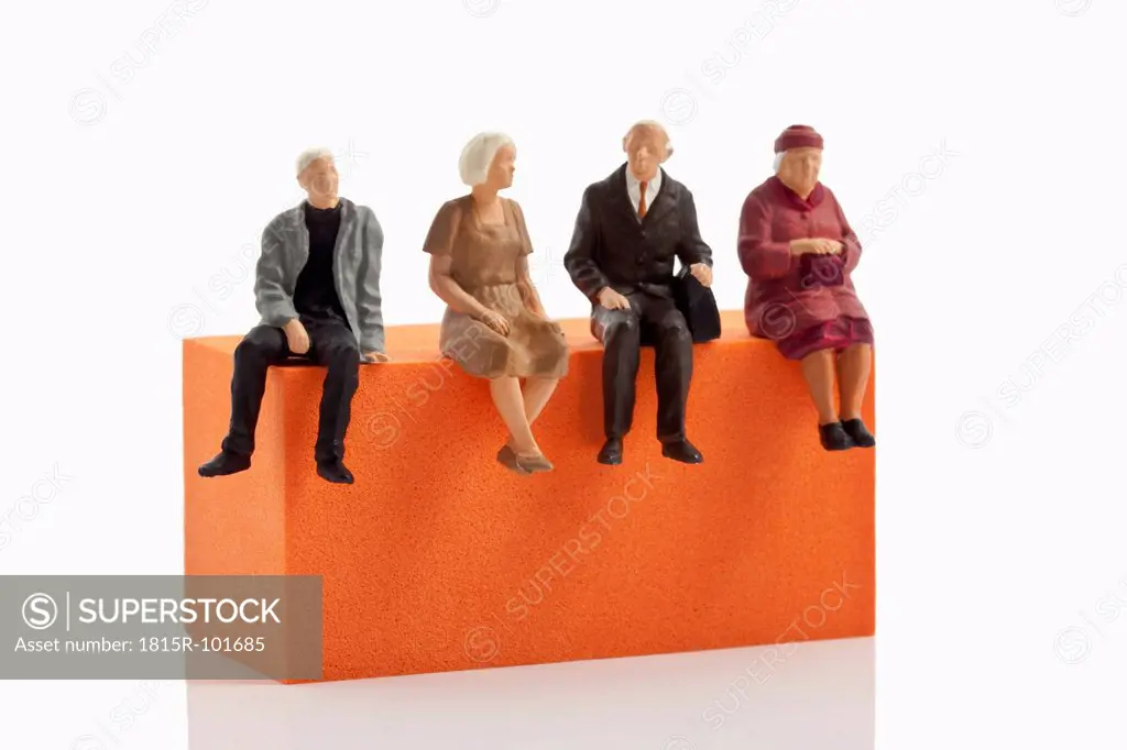 Figurines sitting on block