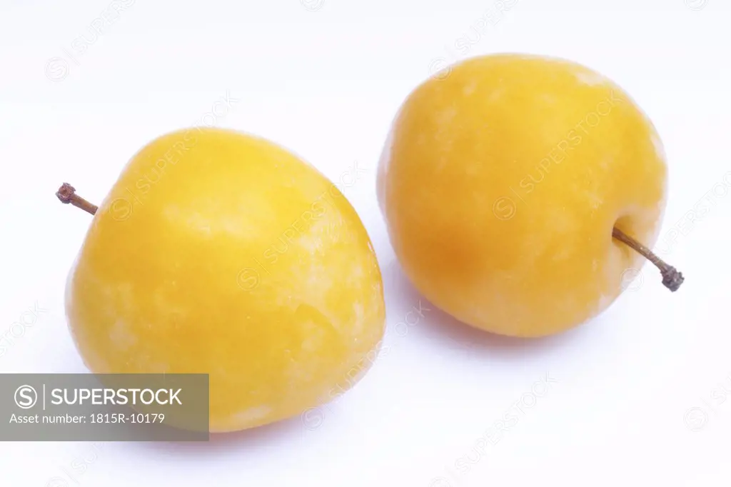 two mirabelles, cut-out, white background