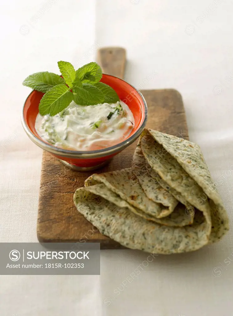 Peppermint yoghurt with turkish flat bread, close up
