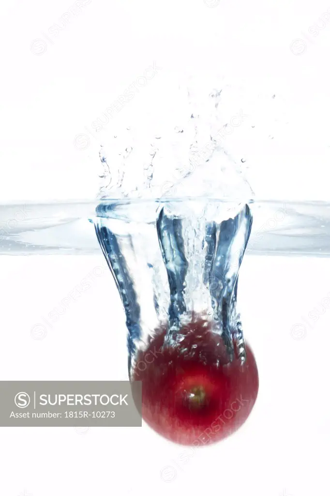 Apple splashing into water