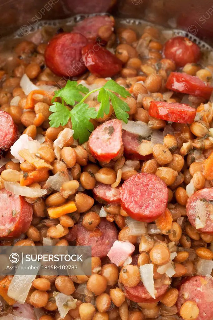 Lentil and sausage in hot pot, close up