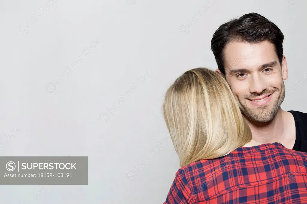 Man and woman embracing, close up