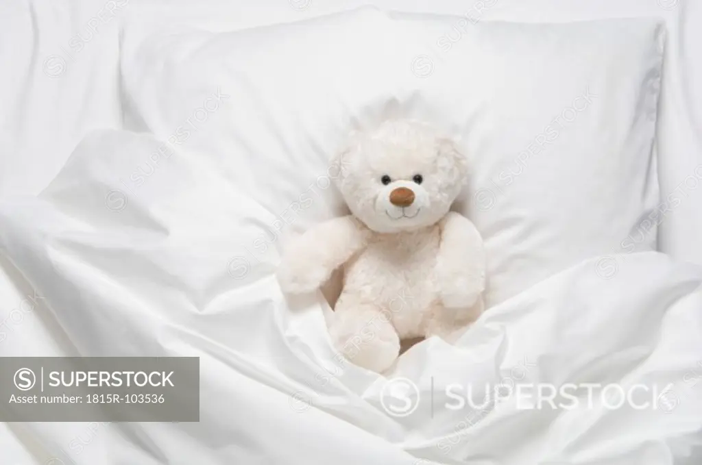 Teddy bear on bed