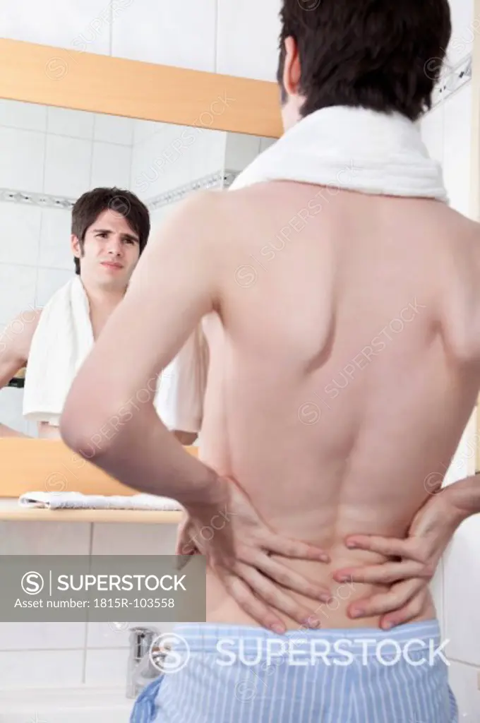 Young man having back pain