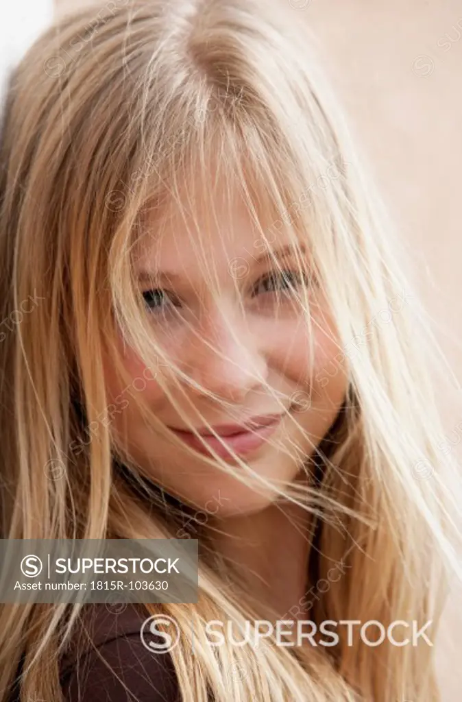 Austria, Teenage girl smiling, portrait