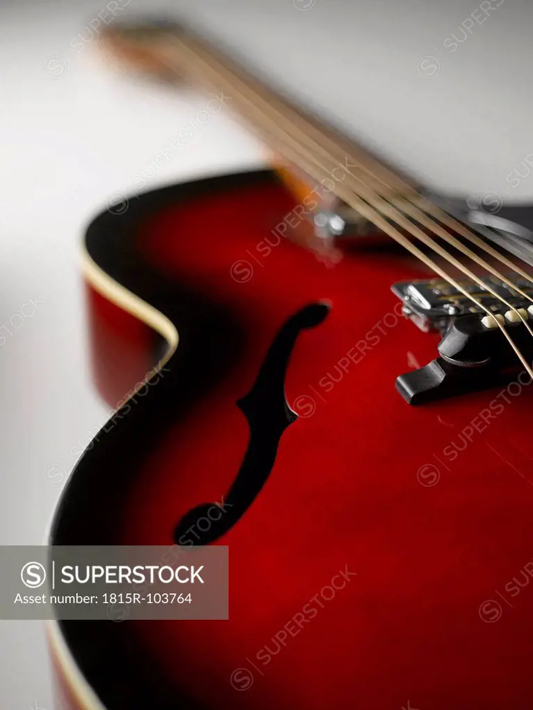 Guitar on white background, close up