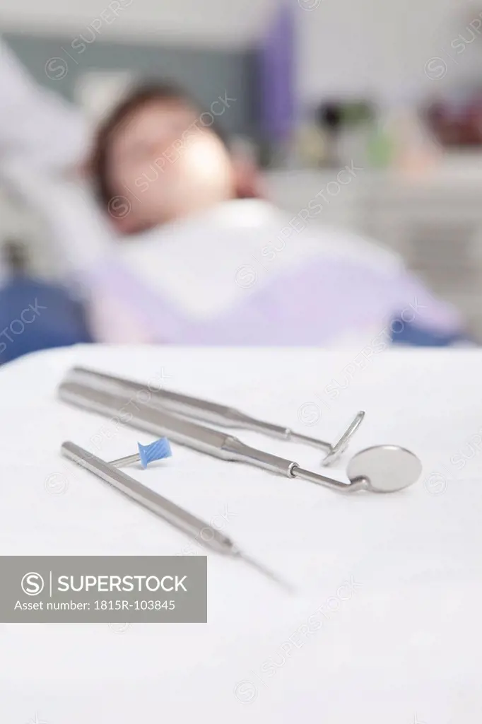 Germany, Bavaria, Dental instrument with patient in background