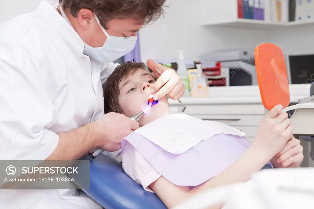 Germany, Bavaria, Dentist examining patient