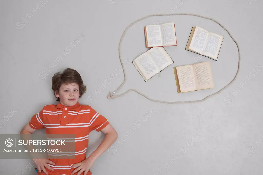 Boy with books in speech bubble, portrait