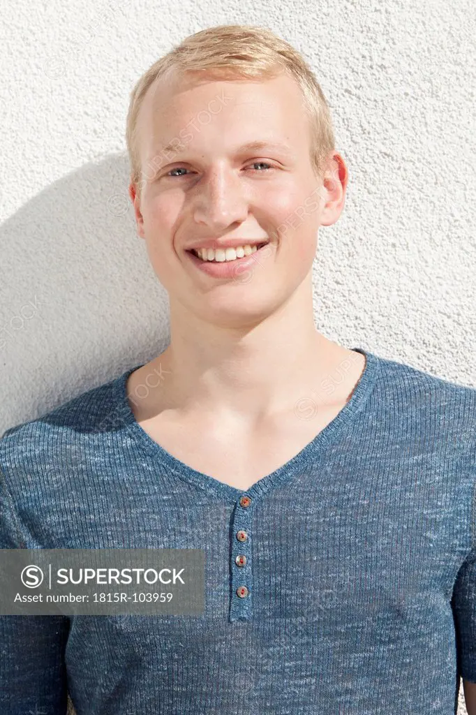 Germany, Bavaria, Young man smiling, portrait