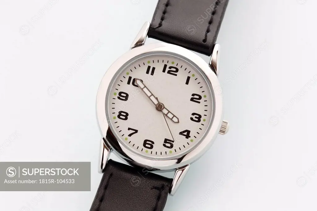 Wrist watch on white background, close up