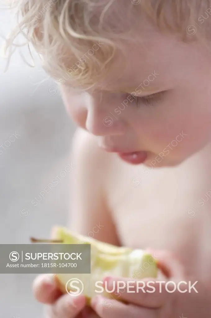 Germany, Bavaria, Boy eating apple, close up