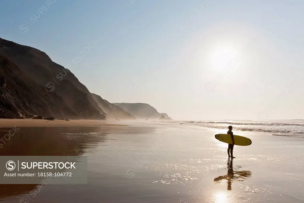 Portugal, Surfer on beach
