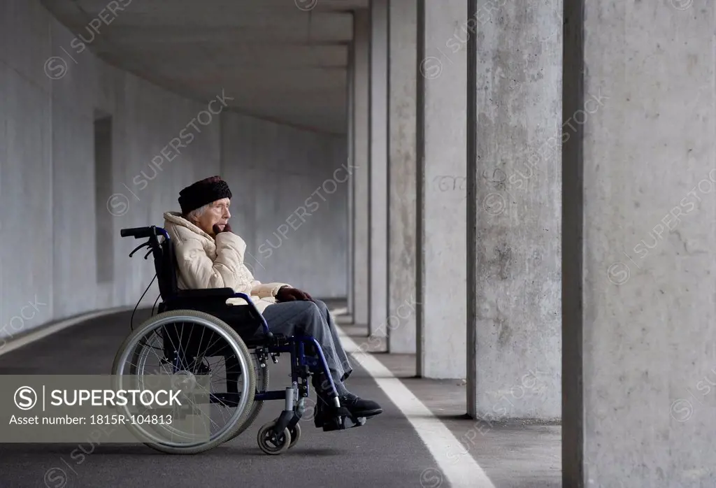 Austria, Senior woman on wheelchair at Subway