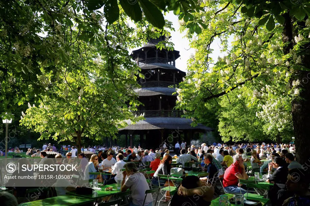 Germany, Bavaria, Munich, English Garden, Chinese Tower, People sitting at Beer garden