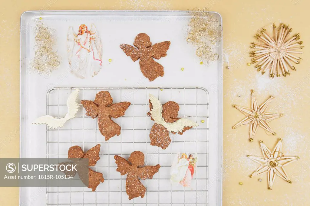 Freshly baked christmas angel cookies on baking tray