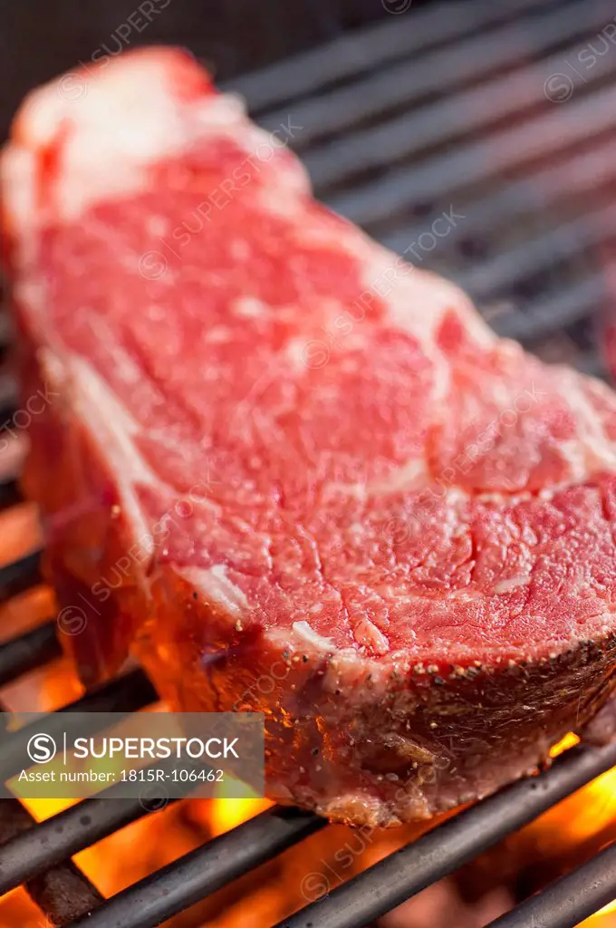 USA, Texas, Grilling rib eye steak, close up