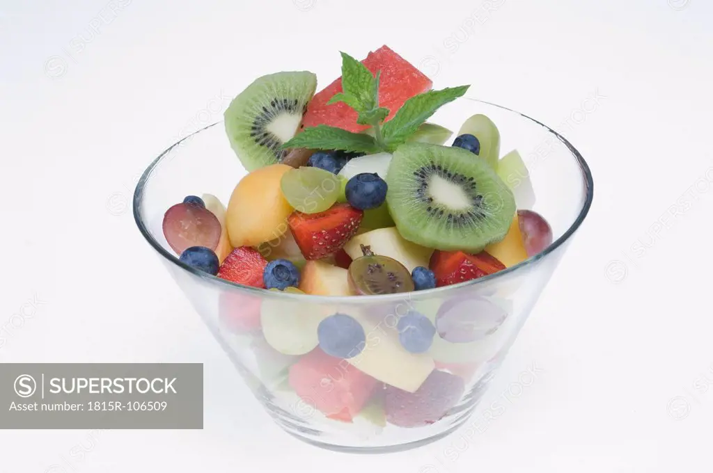 Bowl of fruit salad on white background