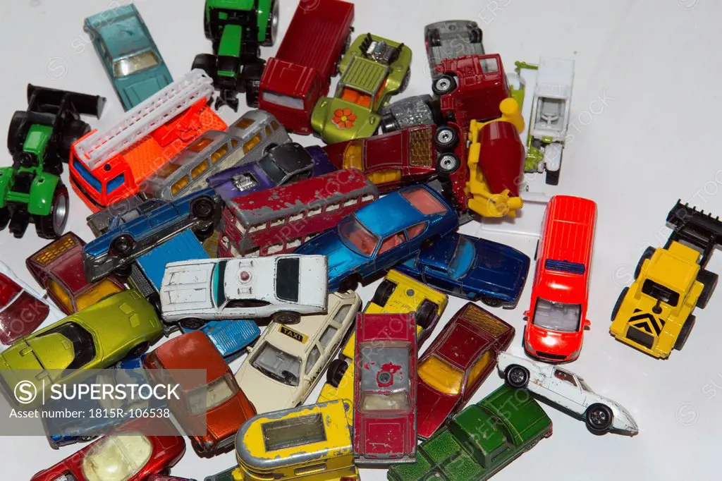 Collection of toy cars on white background