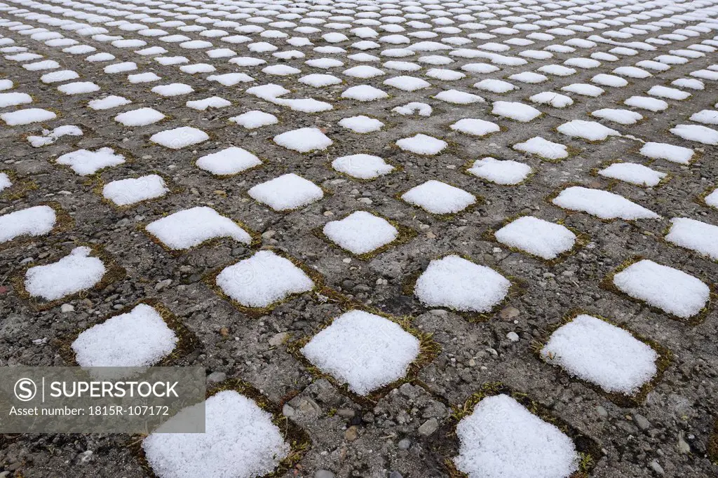 Germany, Bavaria, Franconia, Snow squares between concrete stones