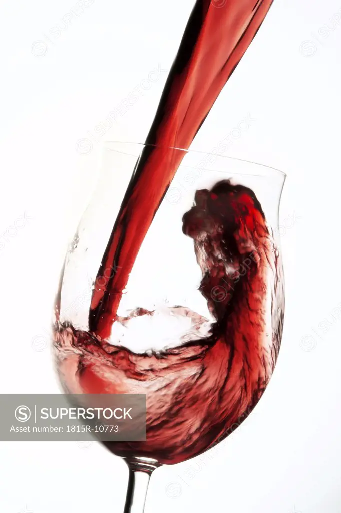 Red wine pouring into winw glass